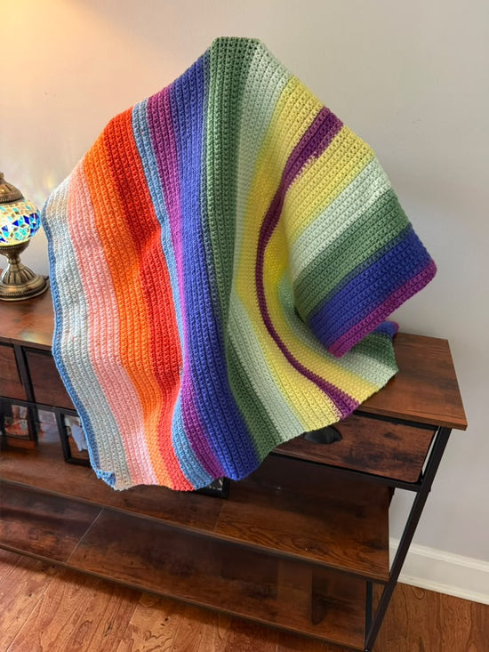 Hand crocheted baby blanket in colorful colors