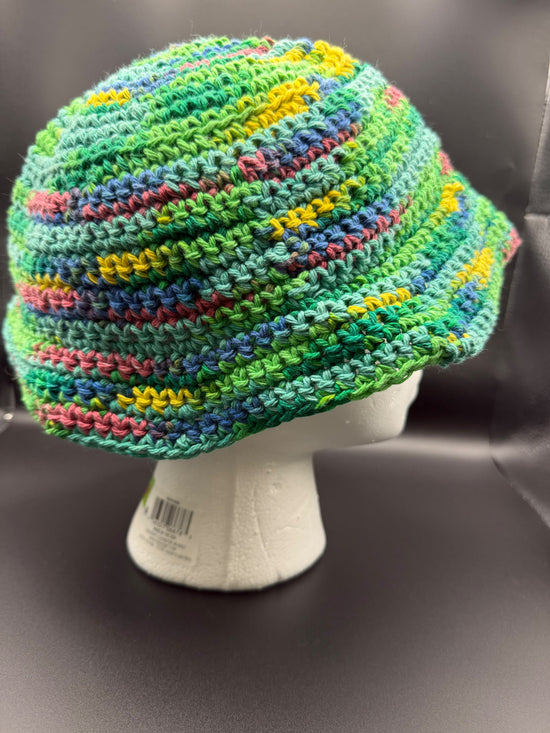 Hand made crocheted bucket hat made with green multi colored cotton yarn.